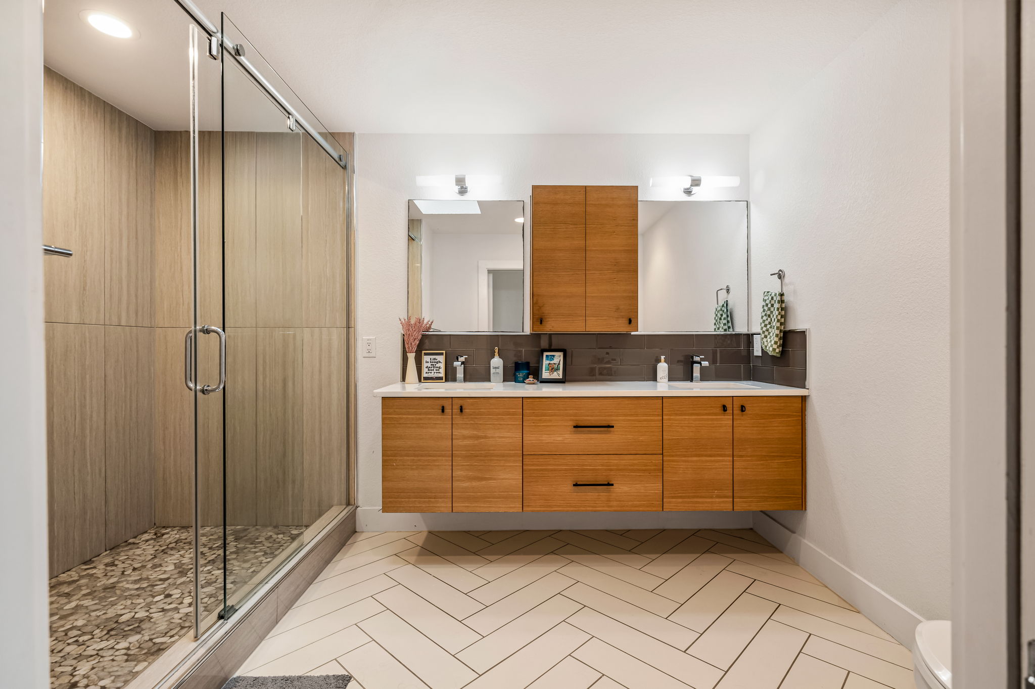 1124 Linden Street, Unit B Austin, TX 78702 - Photo 10 of 26 Full bath with double vanity, a shower stall, light tile patterned floors, and tasteful backsplash