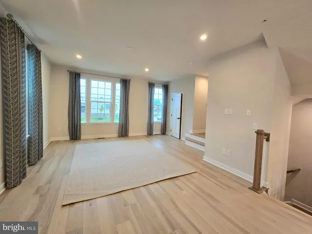 a view of an empty room and a window