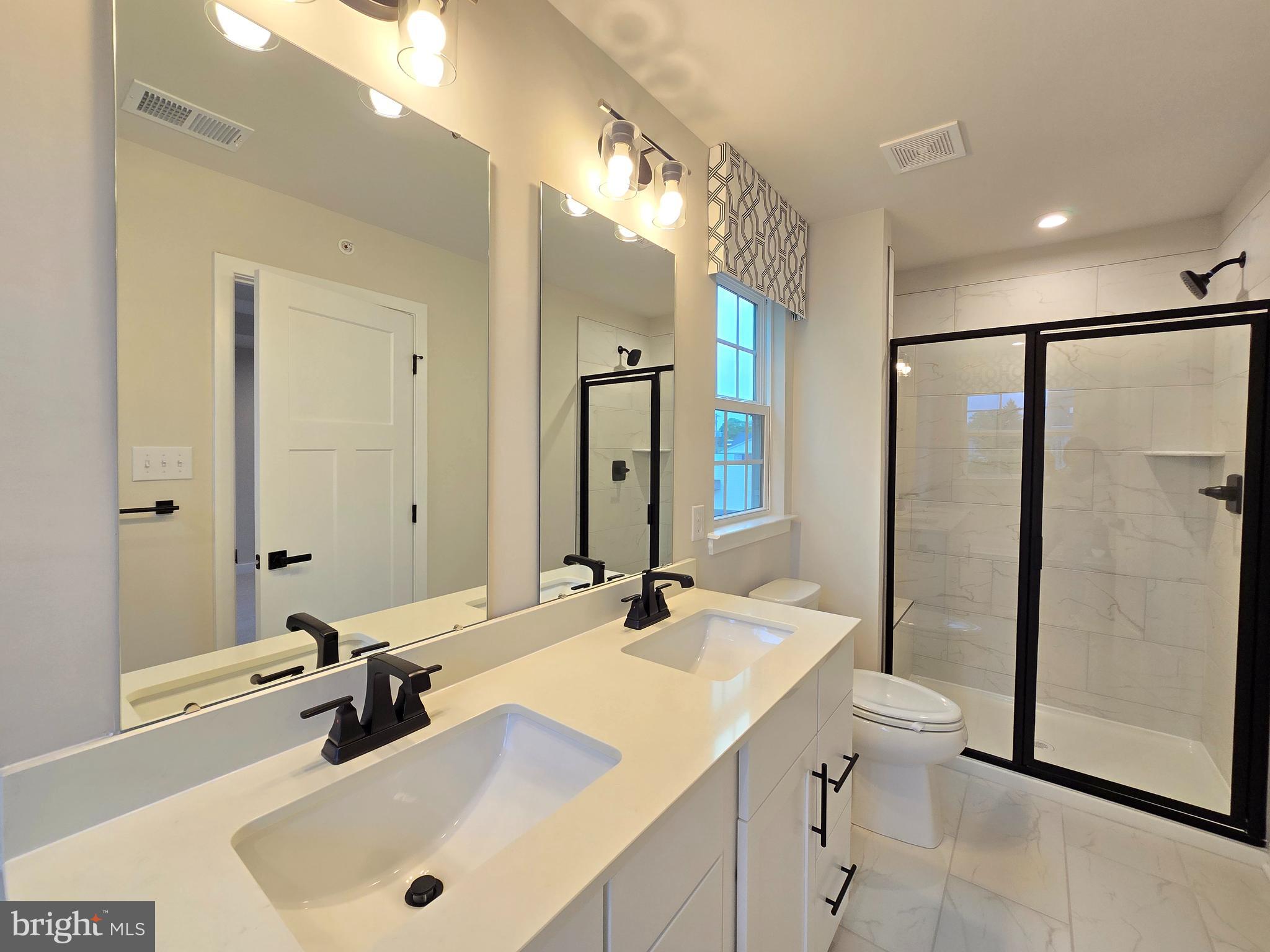 465 Market Street Souderton, PA 18964 - Photo 9 of 13 a bathroom with a tub sink toilet and mirror