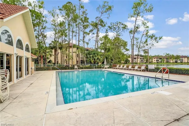 a view of a swimming pool with a lounge chairs