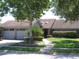 802 Santa Fe Victoria, TX 77904 - Photo 1 of 1 a front view of a house with a garden and yard