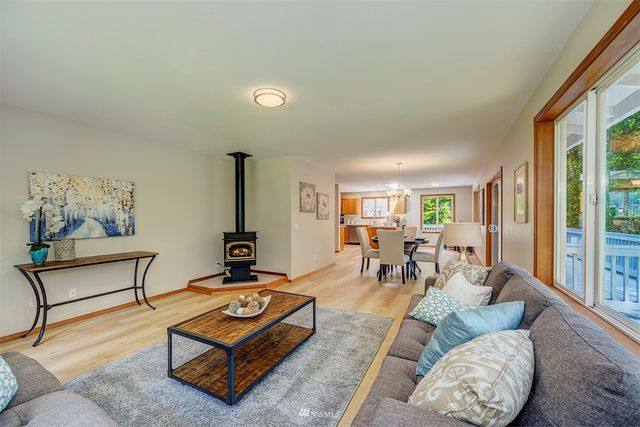 a living room with furniture and large windows