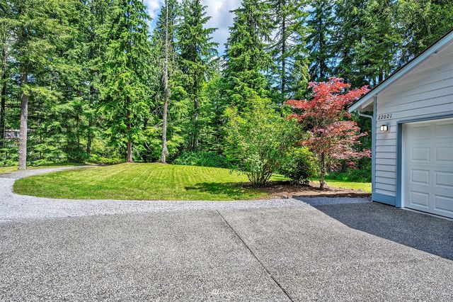 an aerial view of residential house with swimming pool