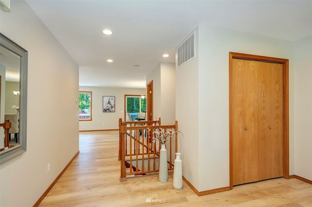 a view of a livingroom with furniture and wooden floor