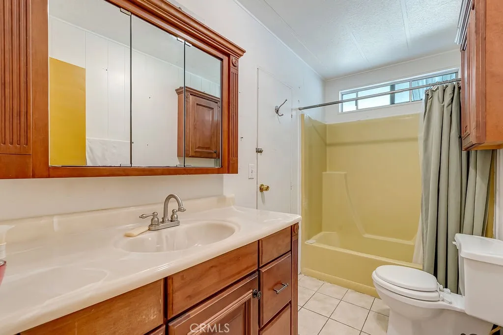 9999 Foothill, Unit 48 Rancho Cucamonga, CA 91730 - Photo 14 of 38 a bathroom with a sink and a mirror