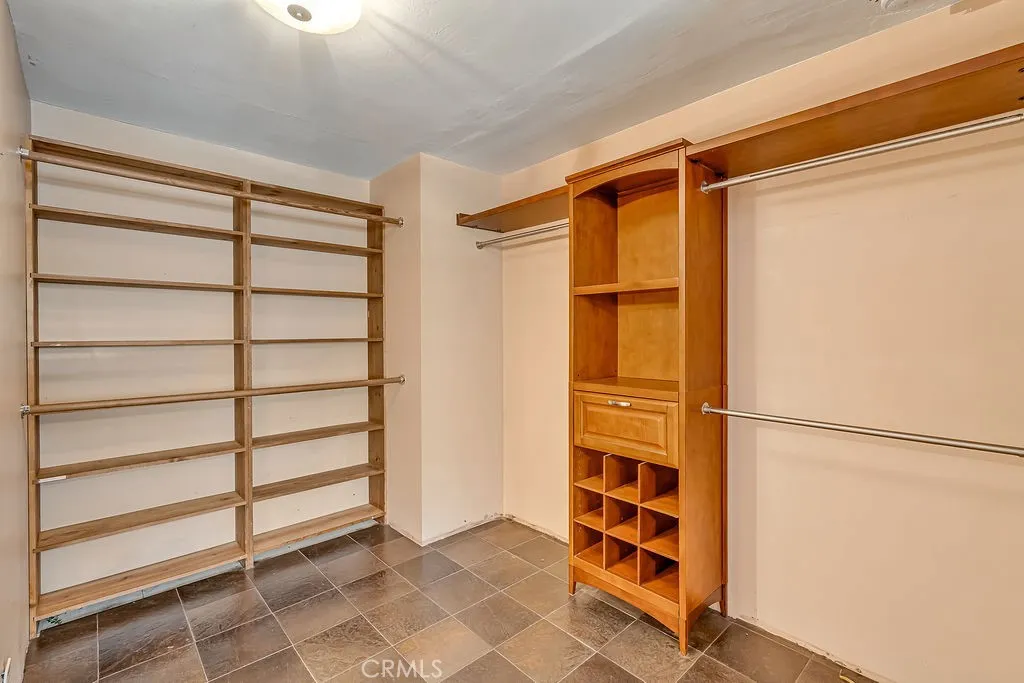 9999 Foothill, Unit 48 Rancho Cucamonga, CA 91730 - Photo 27 of 38 a view of walk in closet with empty racks