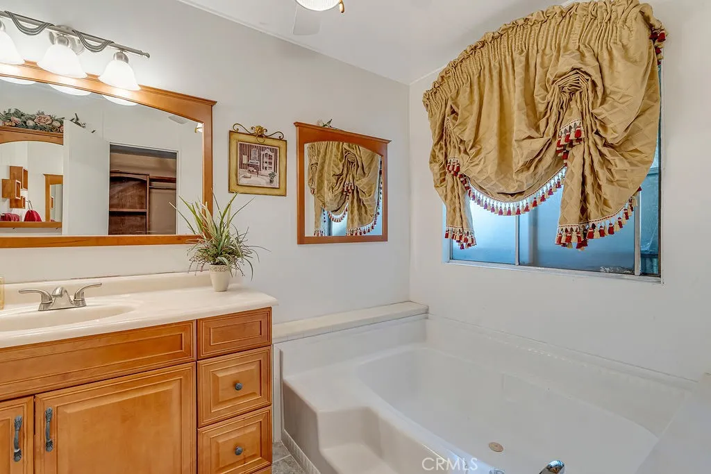9999 Foothill, Unit 48 Rancho Cucamonga, CA 91730 - Photo 29 of 38 a bathroom with a sink and a bathtub