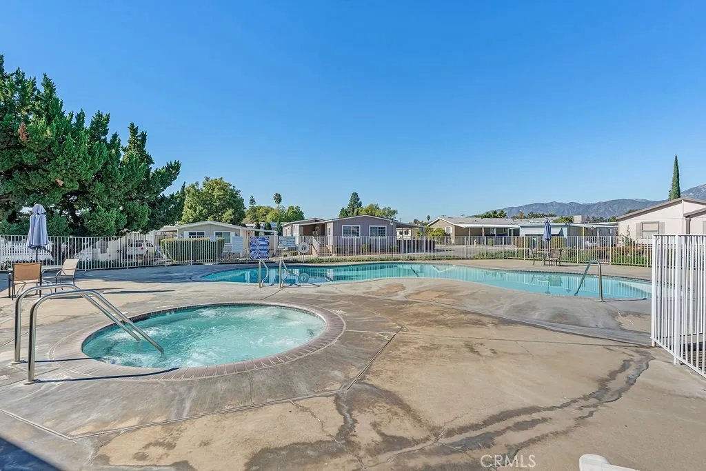 9999 Foothill, Unit 48 Rancho Cucamonga, CA 91730 - Photo 37 of 38 a view of a swimming pool with a terrace