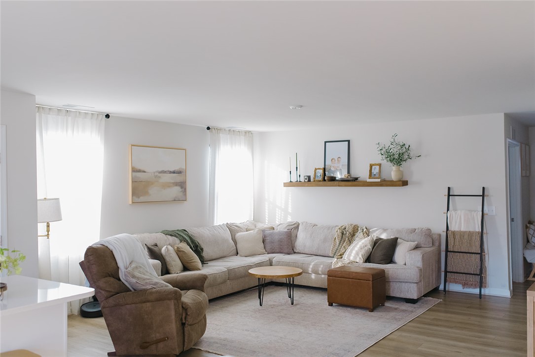 314 Callie Way Easley, SC 29642 - Photo 21 of 27 This bright and airy living space features warm flooring and ample natural light.