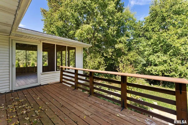 a view of outdoor space with deck and yard