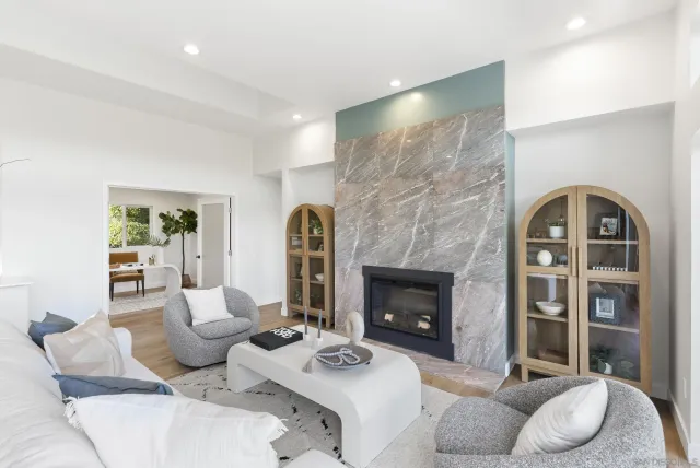 a dining room with furniture and wooden floor