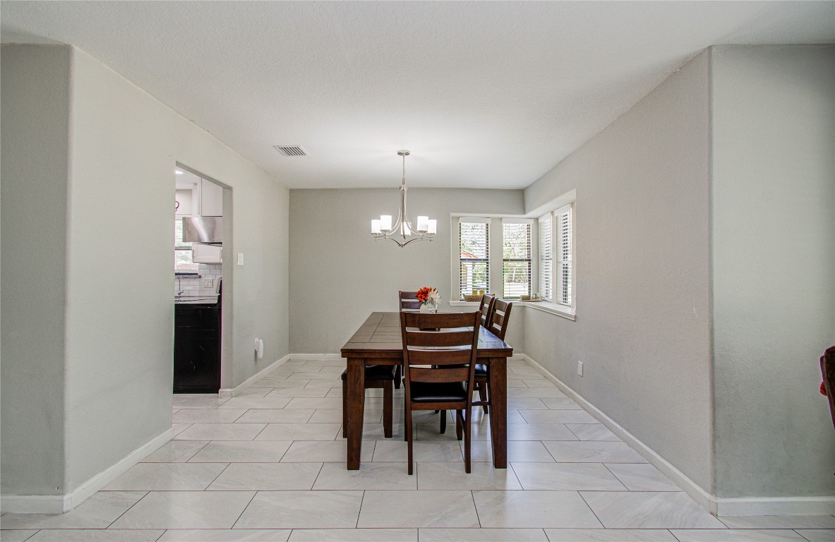 2507 Encreek Road Houston, TX 77068 - Photo 12 of 47 a view of a dining room with furniture