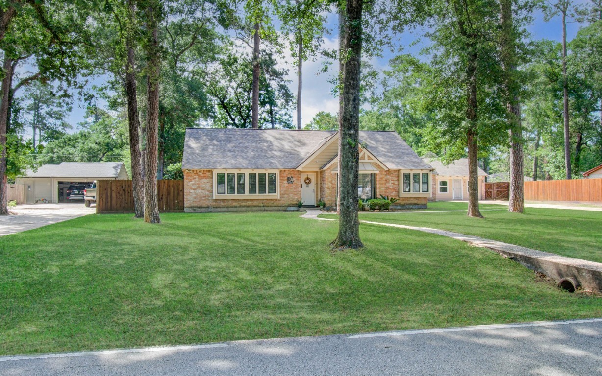 2507 Encreek Road Houston, TX 77068 - Photo 2 of 47 a front view of house with yard and green space