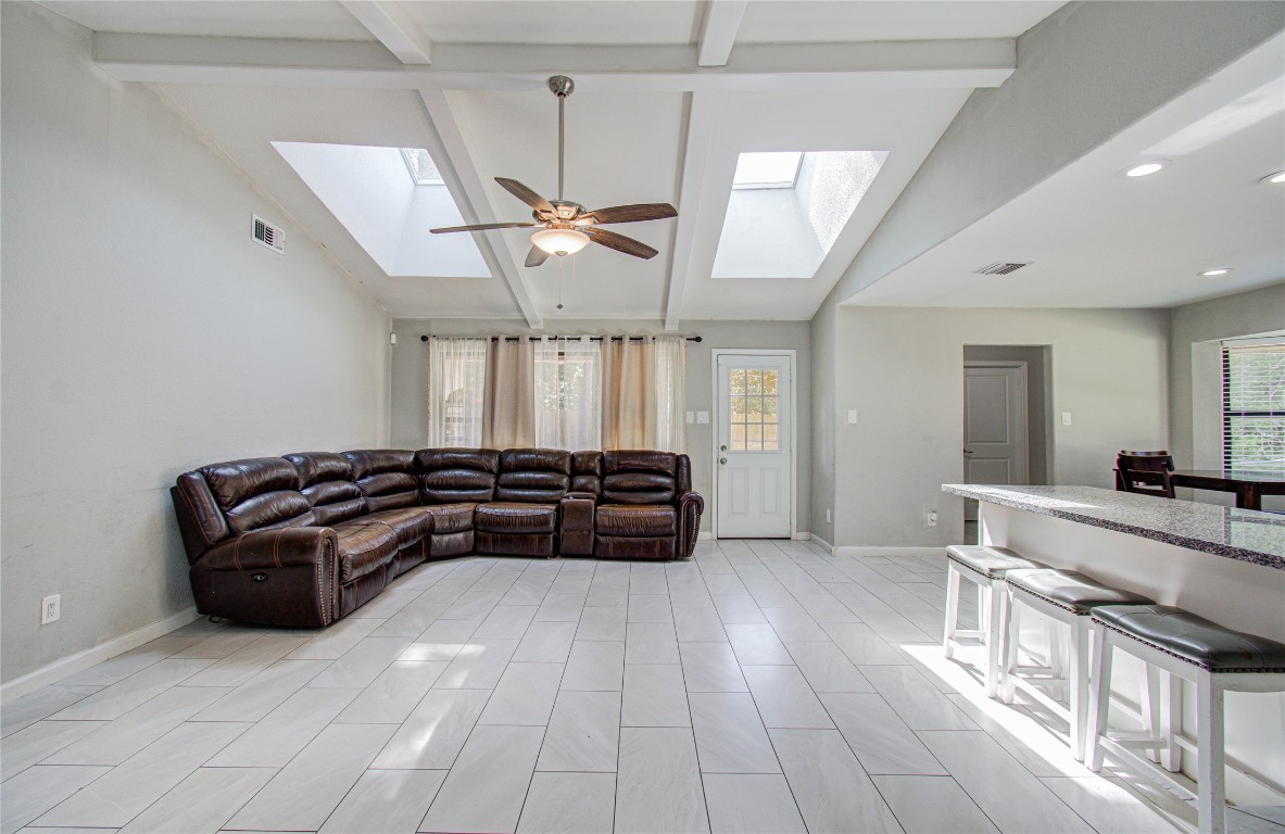 2507 Encreek Road Houston, TX 77068 - Photo 21 of 47 a living room with furniture and a chandelier