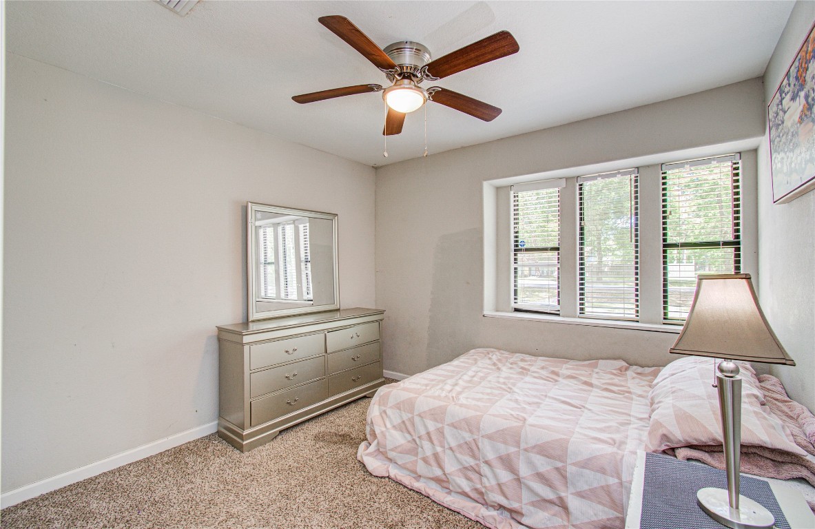 2507 Encreek Road Houston, TX 77068 - Photo 23 of 47 a bedroom with a bed and window