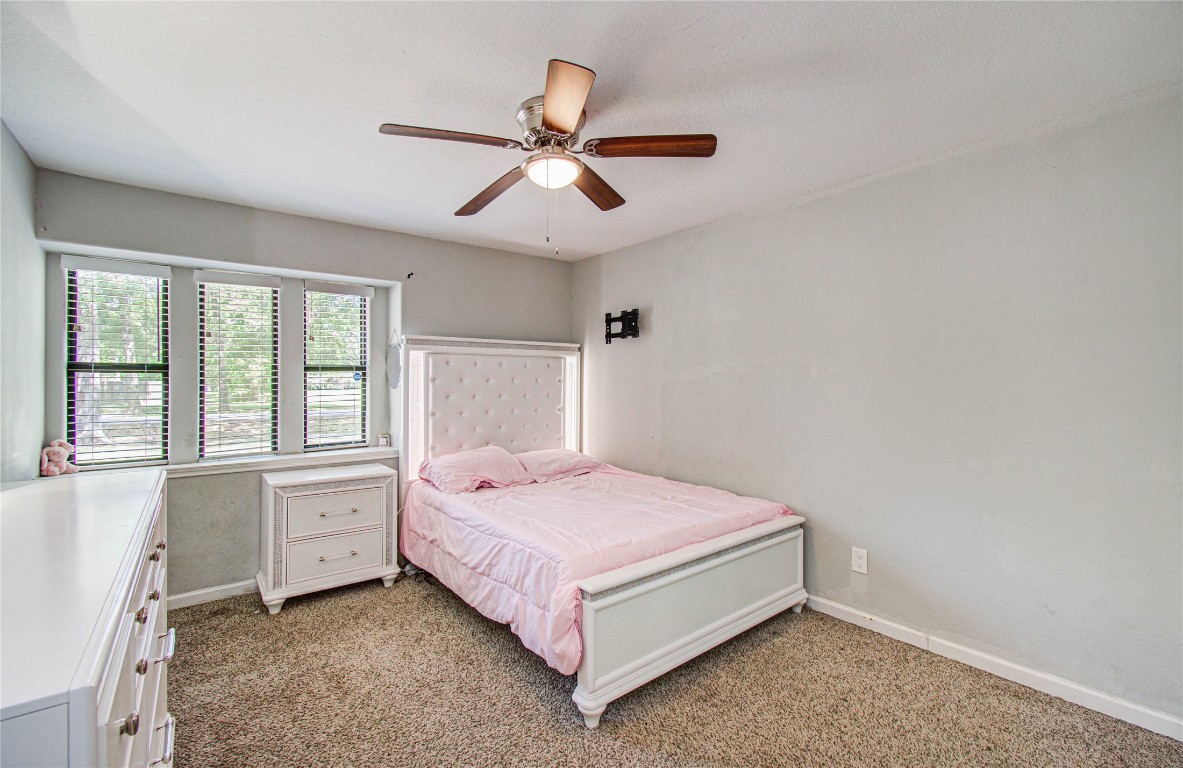 2507 Encreek Road Houston, TX 77068 - Photo 25 of 47 a bedroom with a bed and a window
