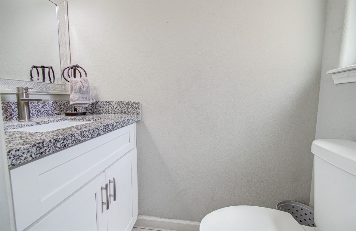 2507 Encreek Road Houston, TX 77068 - Photo 34 of 47 a bathroom with a granite countertop toilet and sink