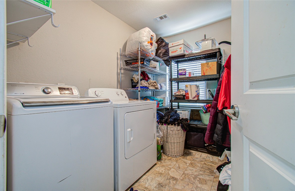 2507 Encreek Road Houston, TX 77068 - Photo 35 of 47 a utility room with dryer and washer