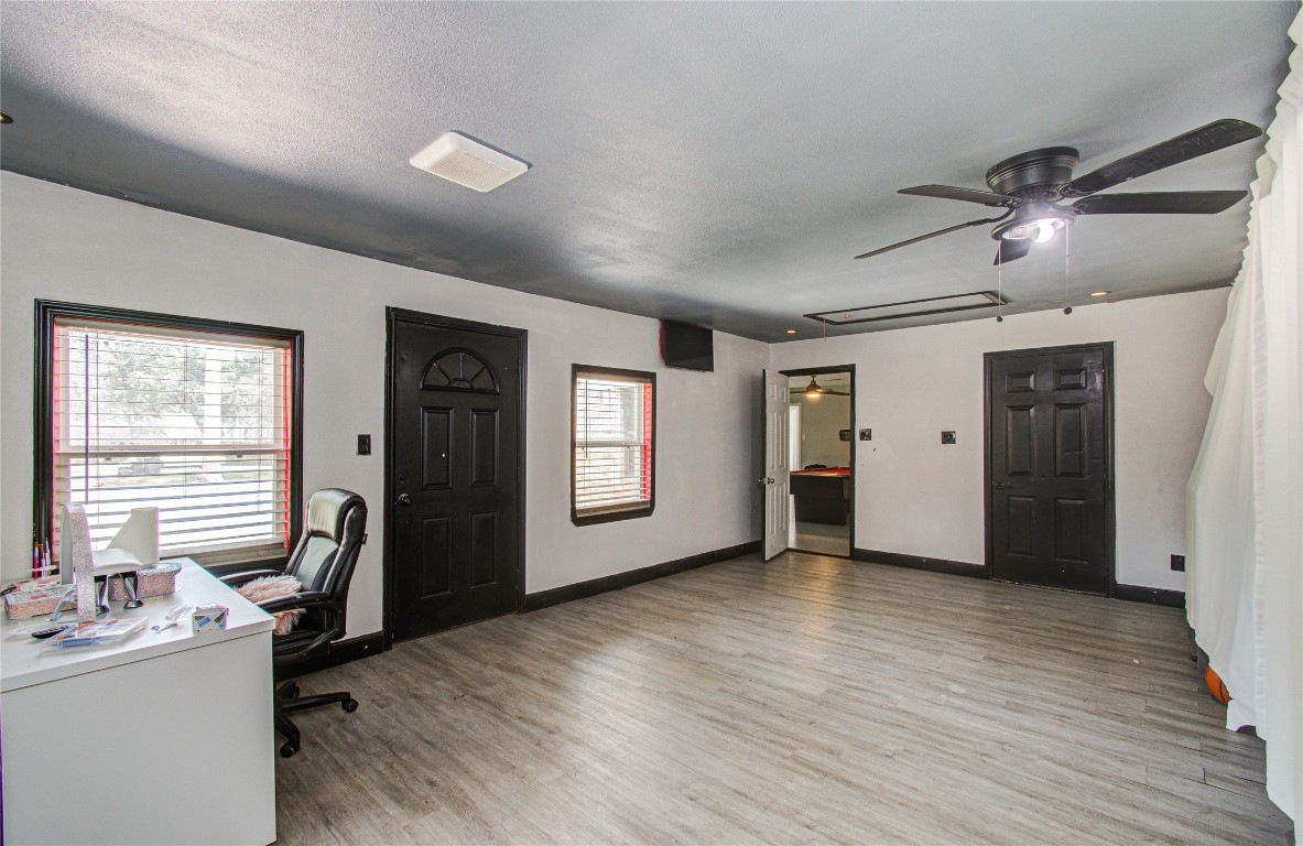 2507 Encreek Road Houston, TX 77068 - Photo 39 of 47 a view of workspace with wooden floor and windows