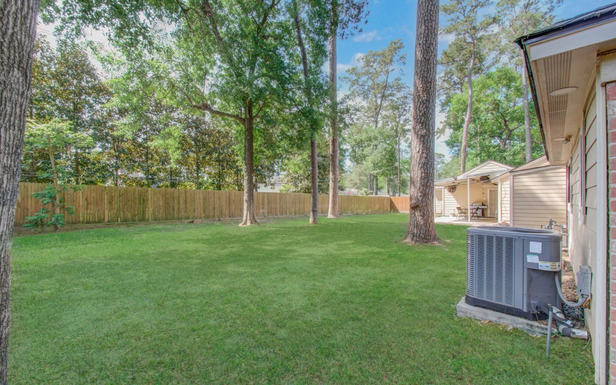 2507 Encreek Road Houston, TX 77068 - Photo 5 of 47 a backyard of a house with table and chairs