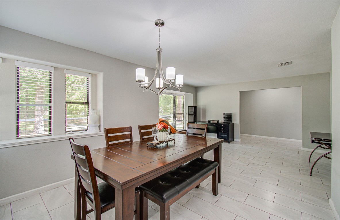 2507 Encreek Road Houston, TX 77068 - Photo 9 of 47 a view of a dining room with furniture window and outside view
