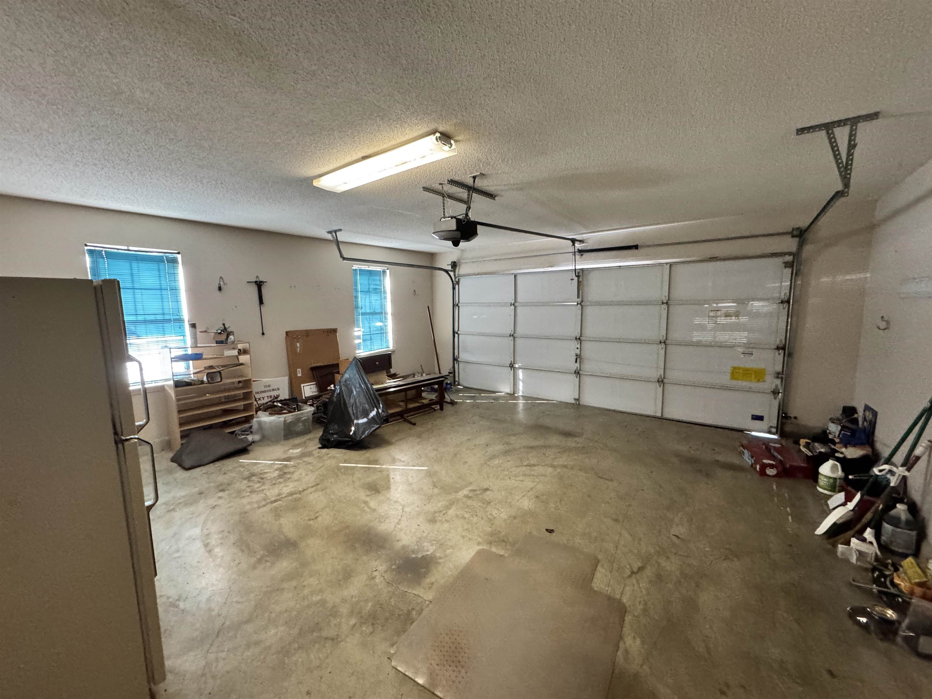 6912 Pleasantwood Road Memphis, TN 38141 - Photo 13 of 20 Garage with freestanding refrigerator