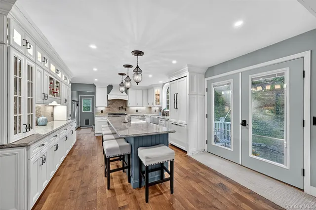 a large kitchen with a table and chairs