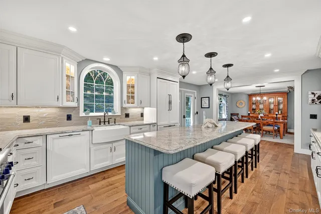 a large kitchen with a table and chairs