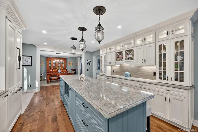 a kitchen with stainless steel appliances granite countertop stove top oven and refrigerator