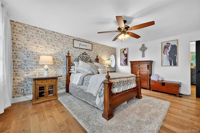 a bedroom with a bed and a fireplace