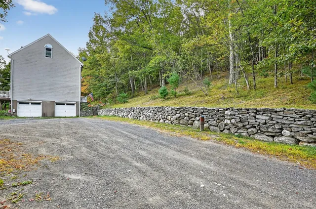 a view of a yard with flower plants
