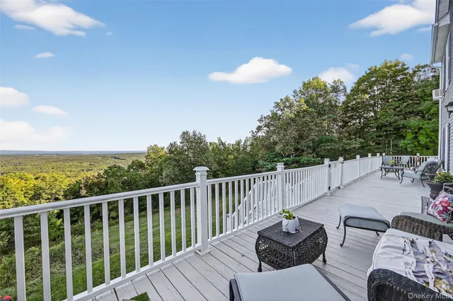 a view from balcony with furniture
