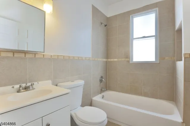 a bathroom with a sink toilet and bathtub