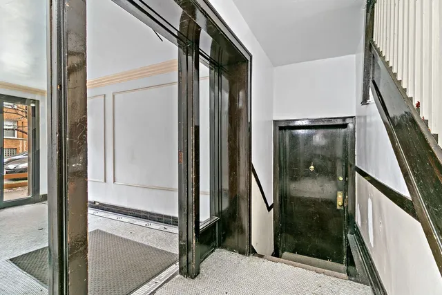 a bathroom with a glass shower door