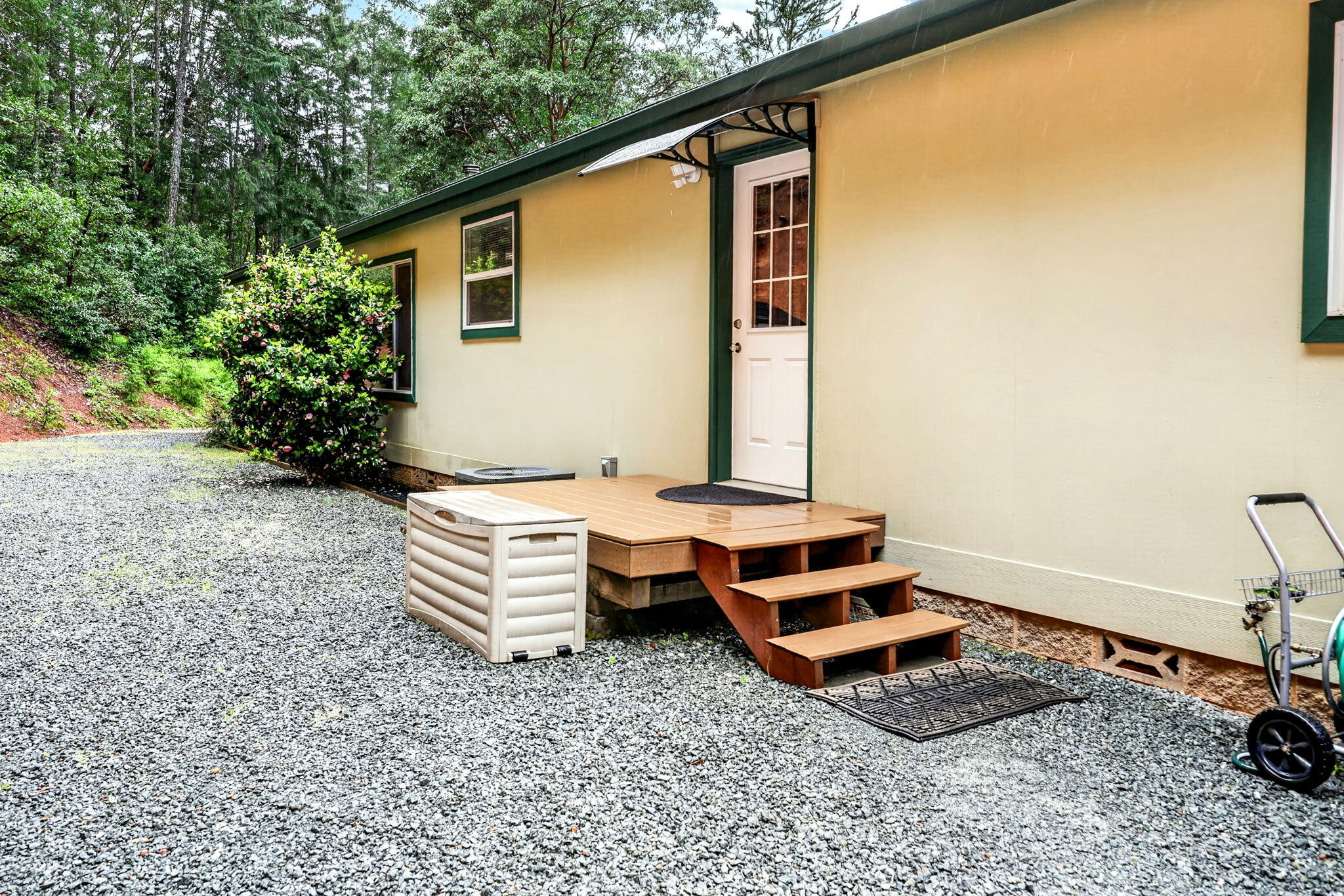 5445 Thompson Creek Road Selma, OR 97538 - Photo 46 of 57 a backyard of a house with wooden floor and outdoor seating