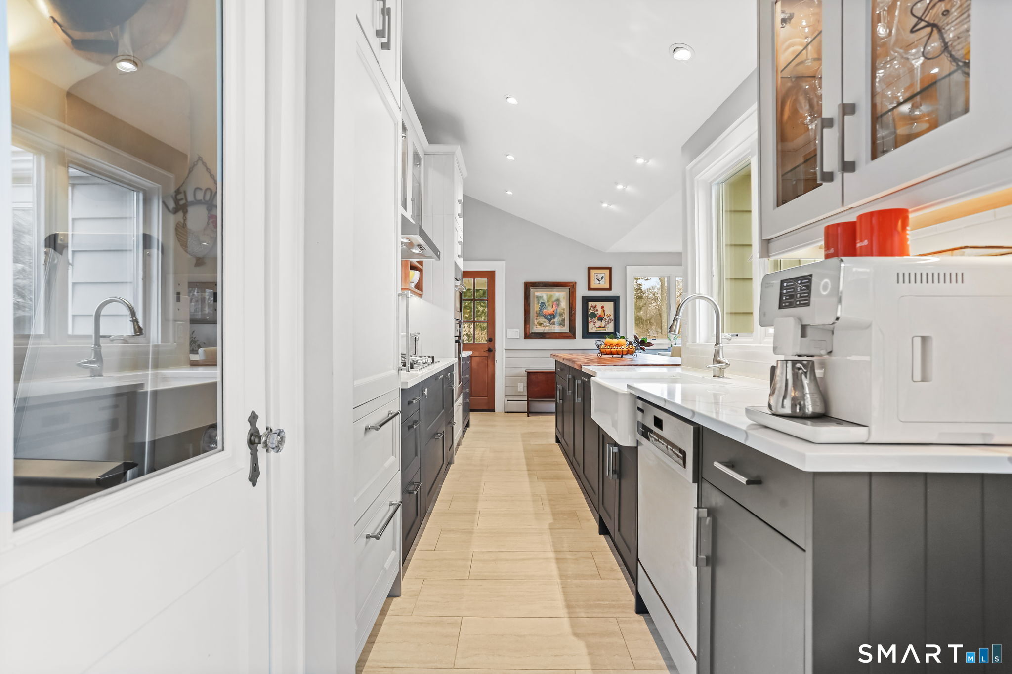 98 Comstock Hill Avenue Norwalk, CT 06850 - Photo 14 of 40 a large kitchen with stainless steel appliances granite countertop a lot of counter space and a sink