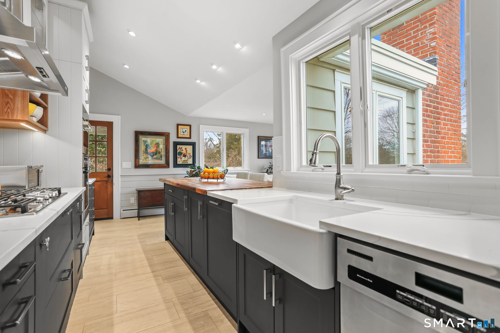 98 Comstock Hill Avenue Norwalk, CT 06850 - Photo 15 of 40 a kitchen with a sink stove and cabinets