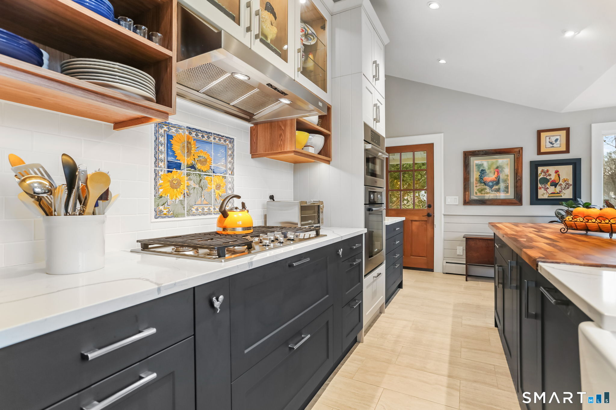 98 Comstock Hill Avenue Norwalk, CT 06850 - Photo 16 of 40 a kitchen with stainless steel appliances a stove a sink and a refrigerator