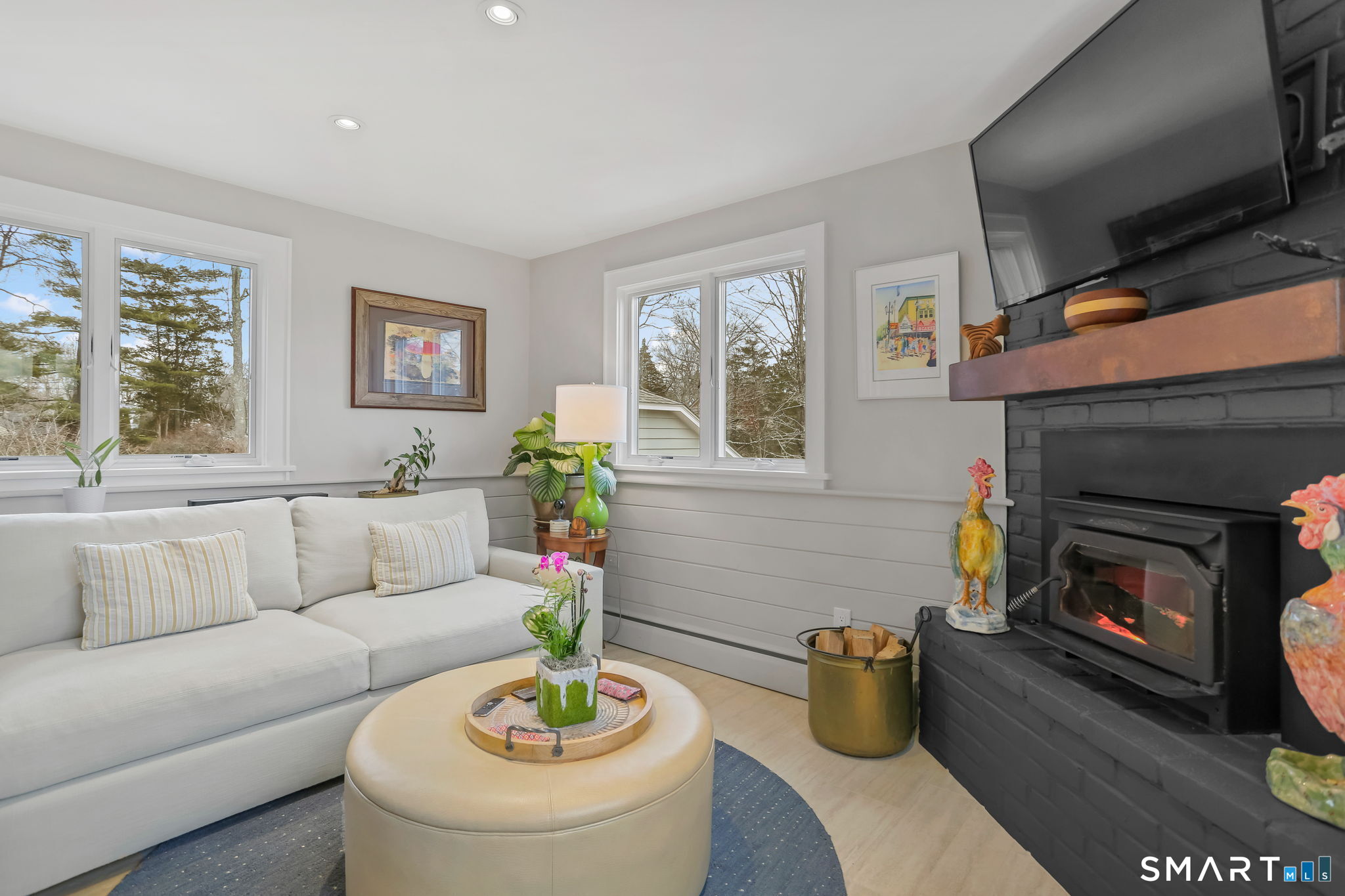 98 Comstock Hill Avenue Norwalk, CT 06850 - Photo 21 of 40 a living room with furniture and a fireplace