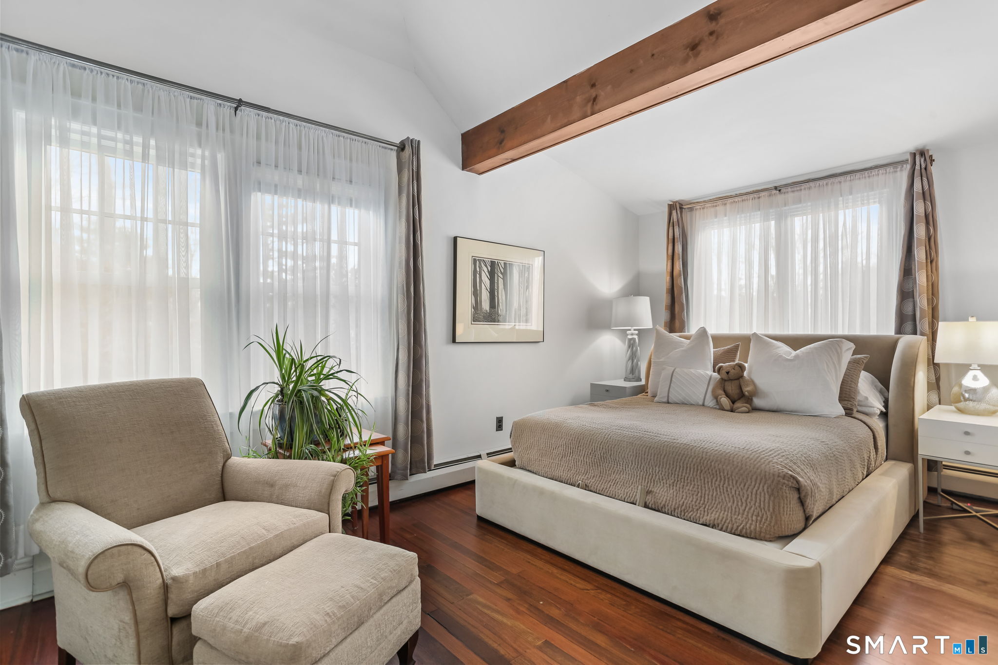 98 Comstock Hill Avenue Norwalk, CT 06850 - Photo 25 of 40 a bedroom with a large bed couch and windows