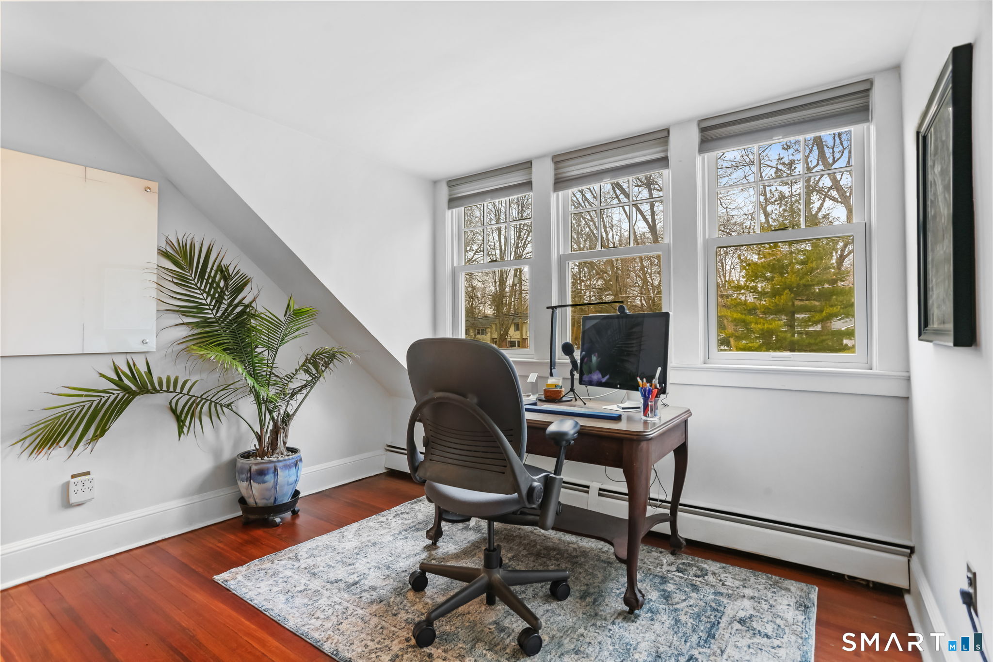 98 Comstock Hill Avenue Norwalk, CT 06850 - Photo 26 of 40 a view of a workspace with furniture and a window