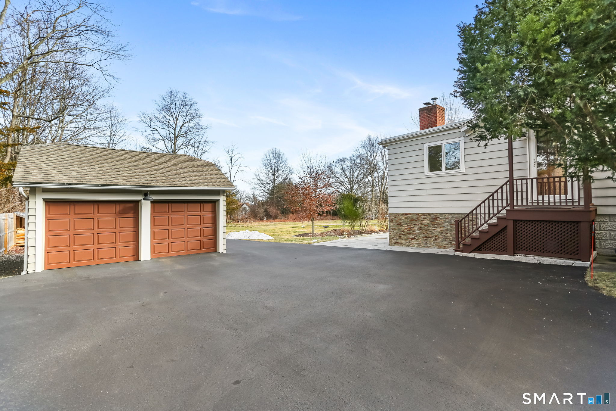98 Comstock Hill Avenue Norwalk, CT 06850 - Photo 36 of 40 a view of a house with a outdoor space and backyard