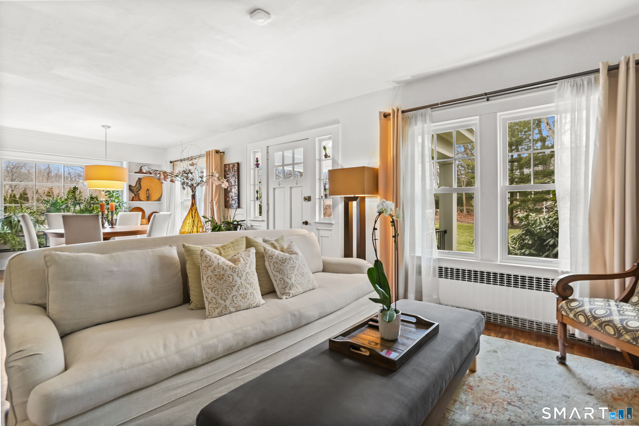 98 Comstock Hill Avenue Norwalk, CT 06850 - Photo 4 of 40 a living room with furniture and a floor to ceiling window
