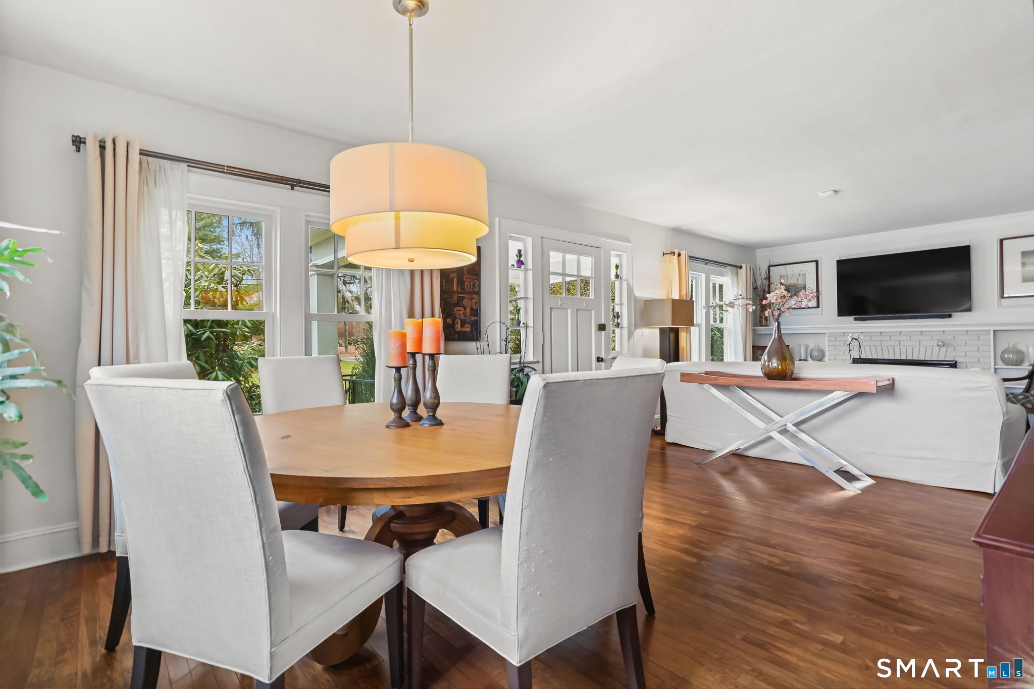 98 Comstock Hill Avenue Norwalk, CT 06850 - Photo 5 of 40 a view of a dining room with furniture window and wooden floor