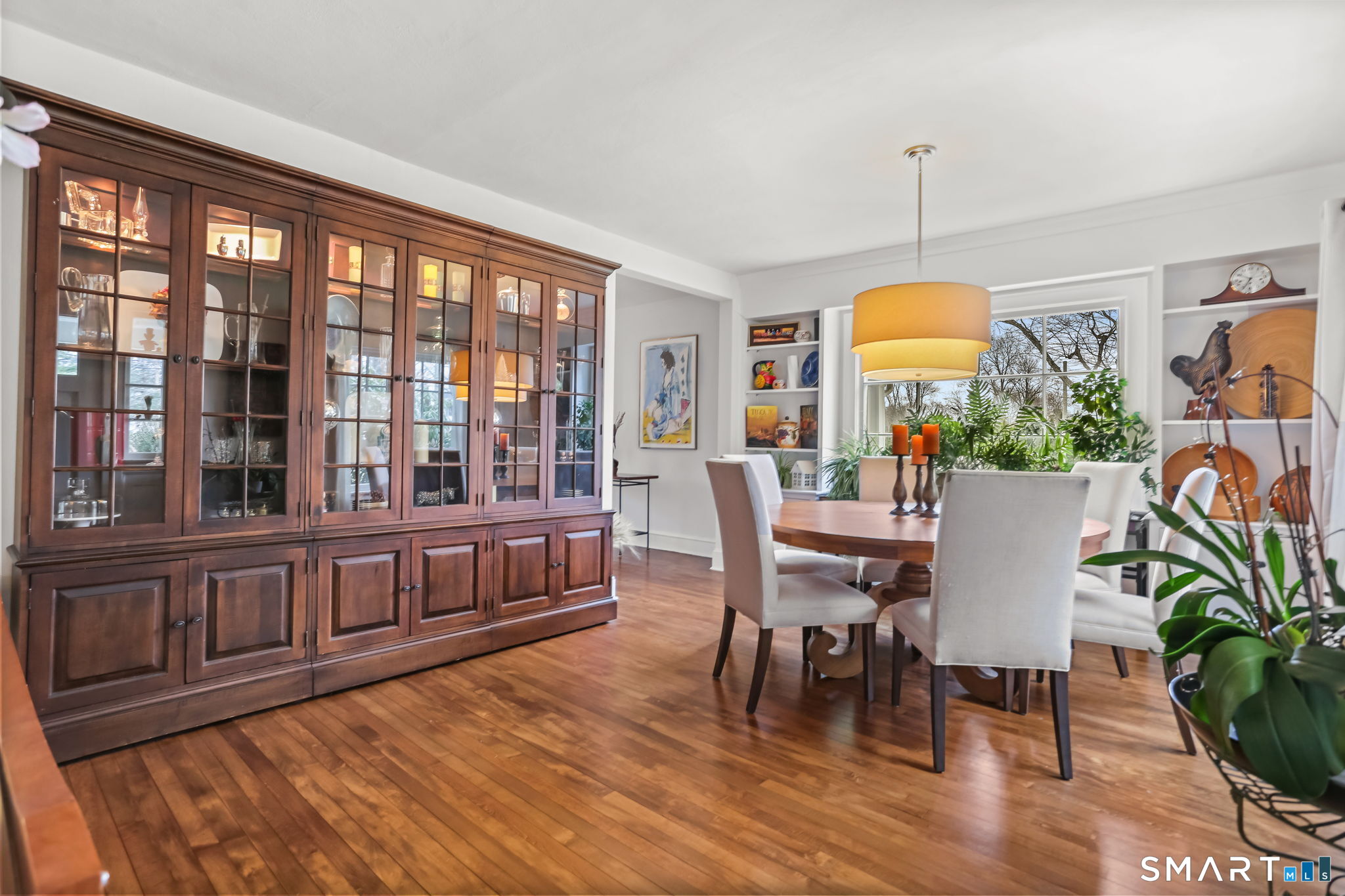 98 Comstock Hill Avenue Norwalk, CT 06850 - Photo 7 of 40 a view of a dining room with furniture window and wooden floor