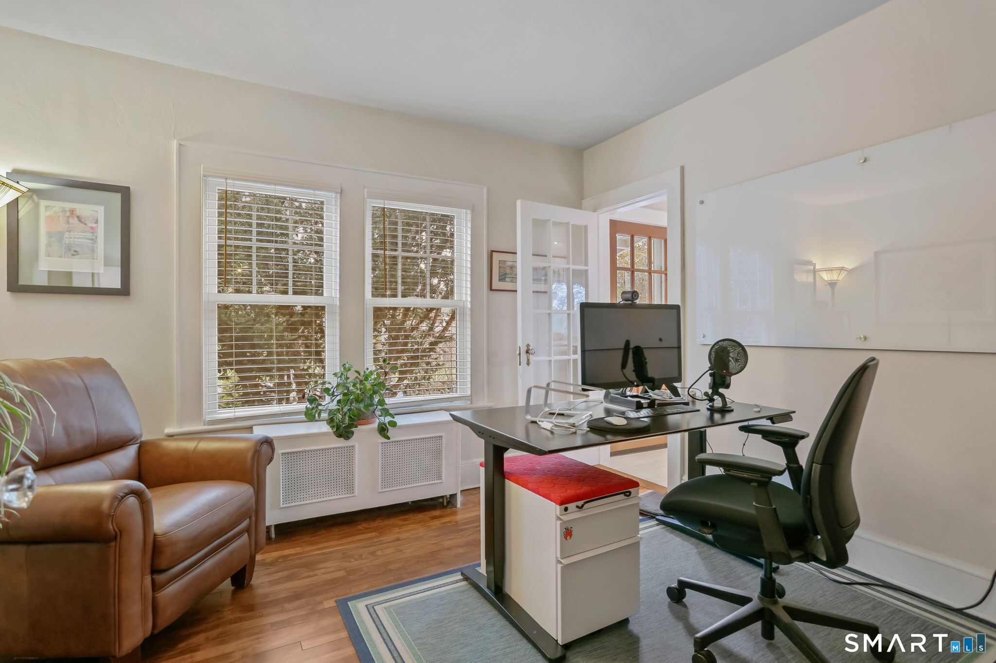 98 Comstock Hill Avenue Norwalk, CT 06850 - Photo 8 of 40 a living room with furniture and a fireplace