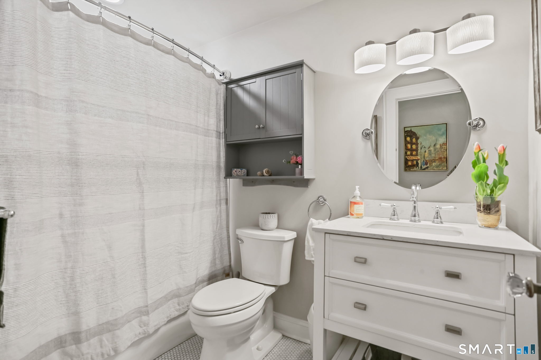 98 Comstock Hill Avenue Norwalk, CT 06850 - Photo 9 of 40 a bathroom with a toilet a sink and mirror