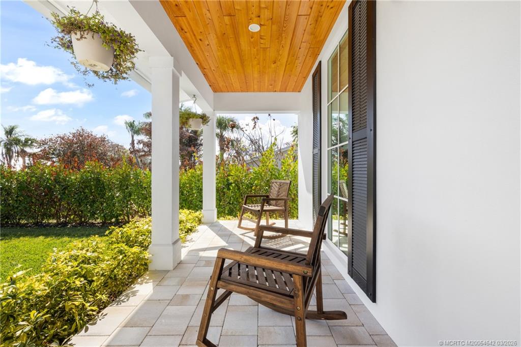 5169 Southeast Horseshoe Point Road Stuart, FL 34997 - Photo 4 of 54 a view of a balcony with chair and table