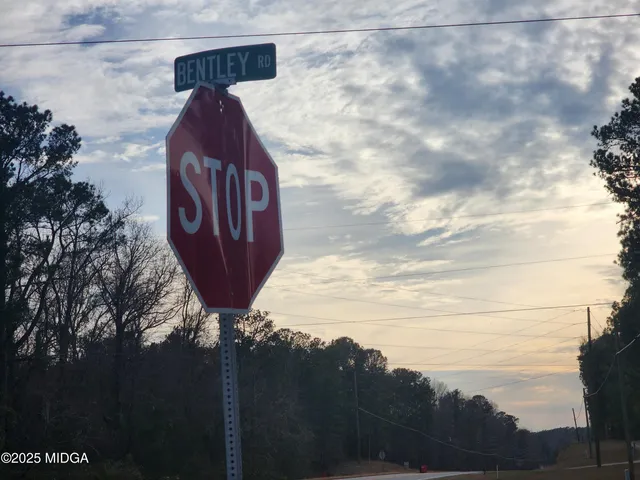 a view of a wooden fence next to a yard
