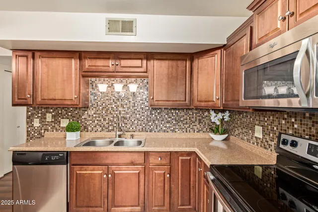 a kitchen with a sink and cabinets